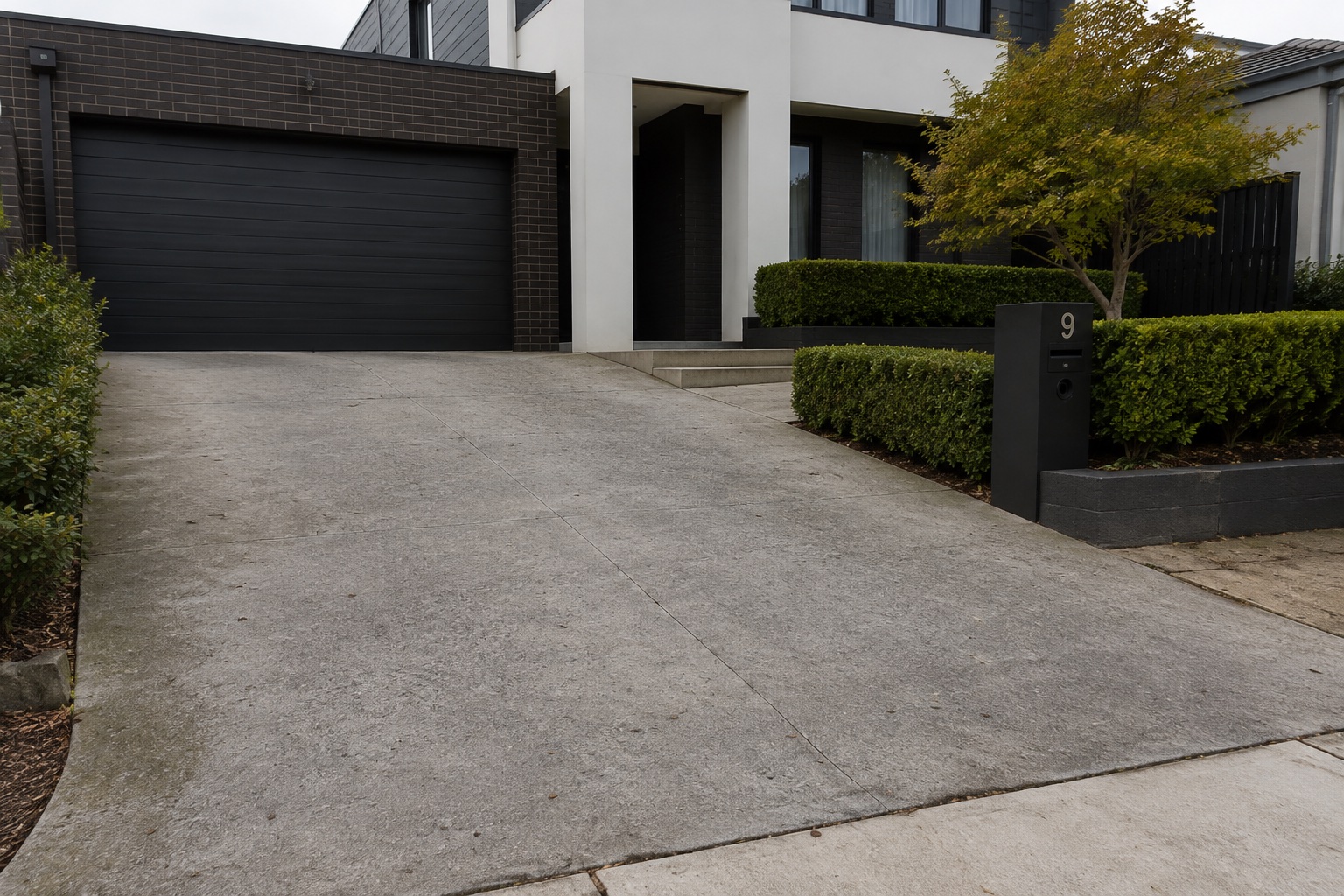 Existing plain concrete driveway before resurfacing