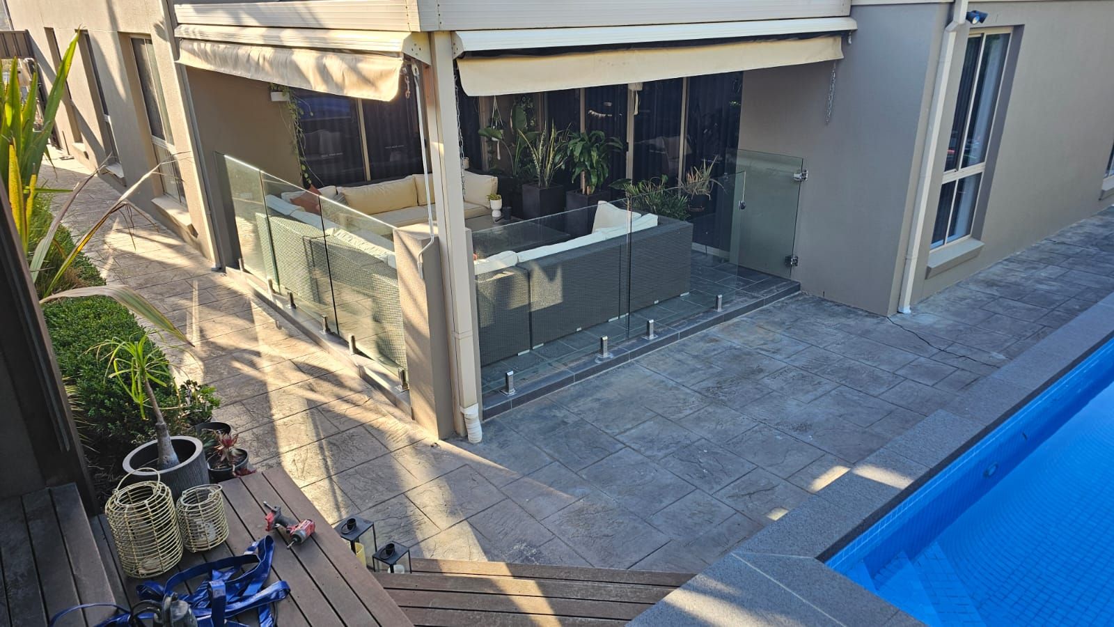 Pool area and alfresco before resurfacing, seen from the deck