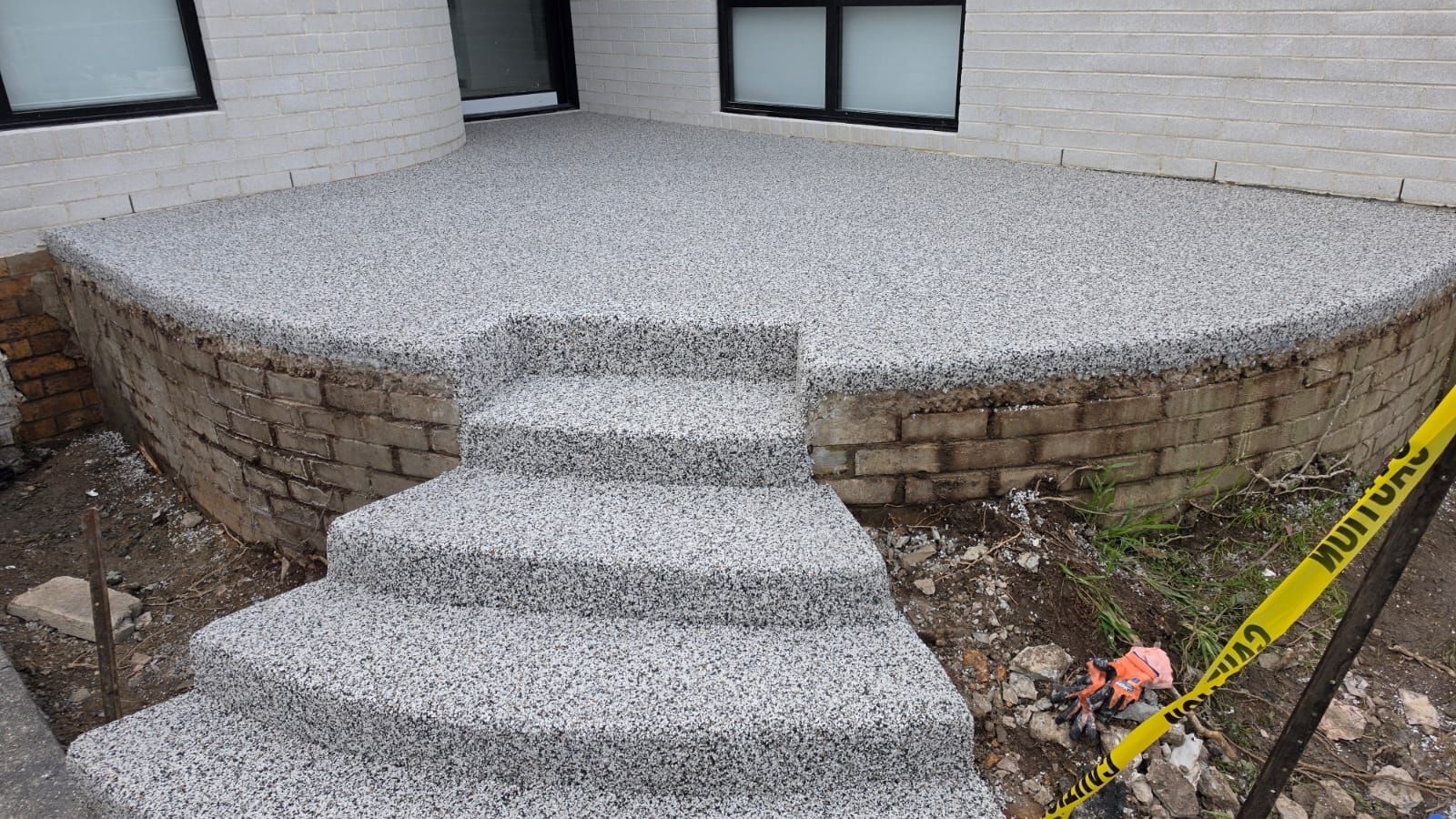 The finished porch and curved steps, resurfaced as one seamless Monaco surface