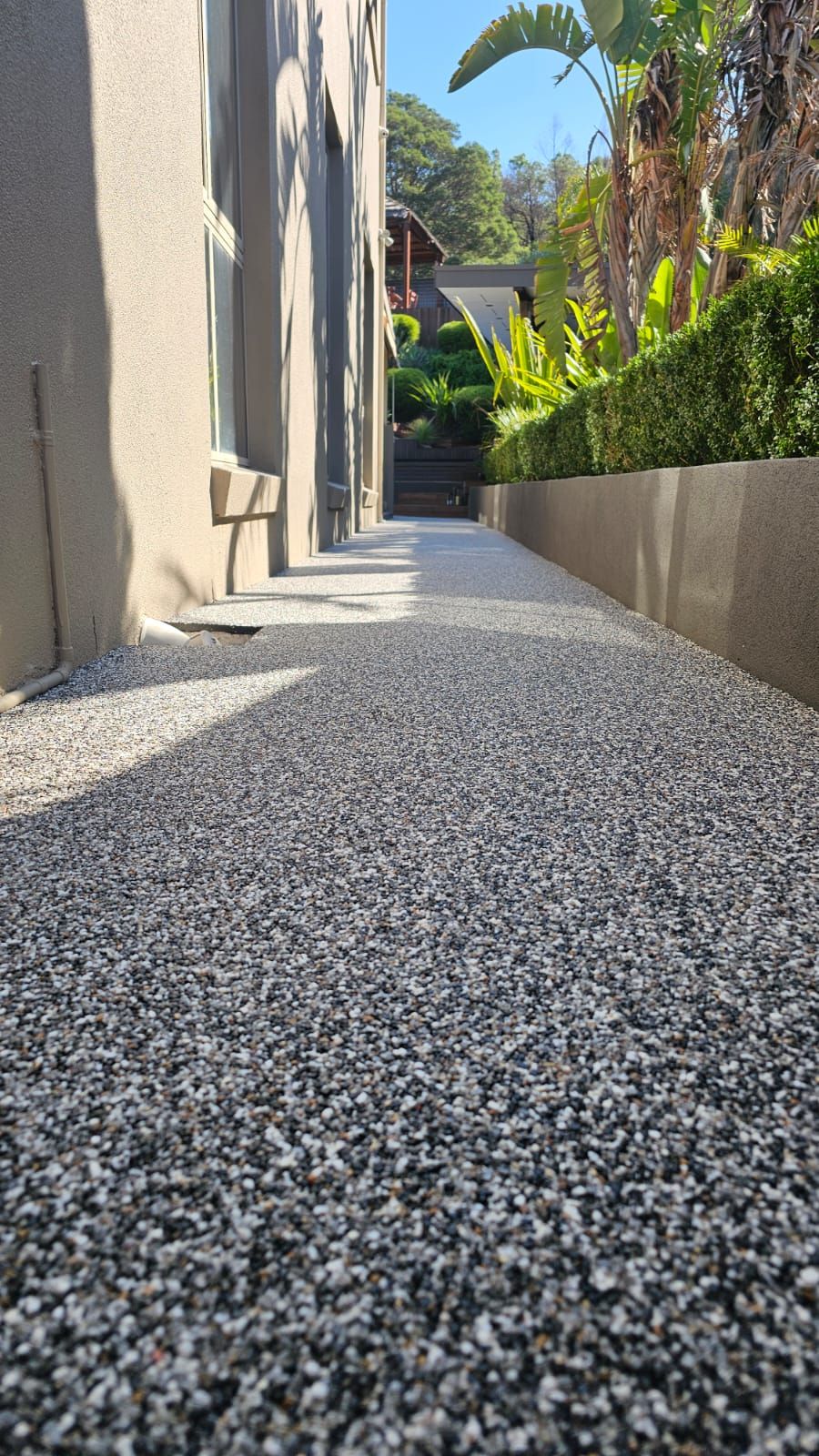 Resin bound side path in Dolomite stone leading to the pool area