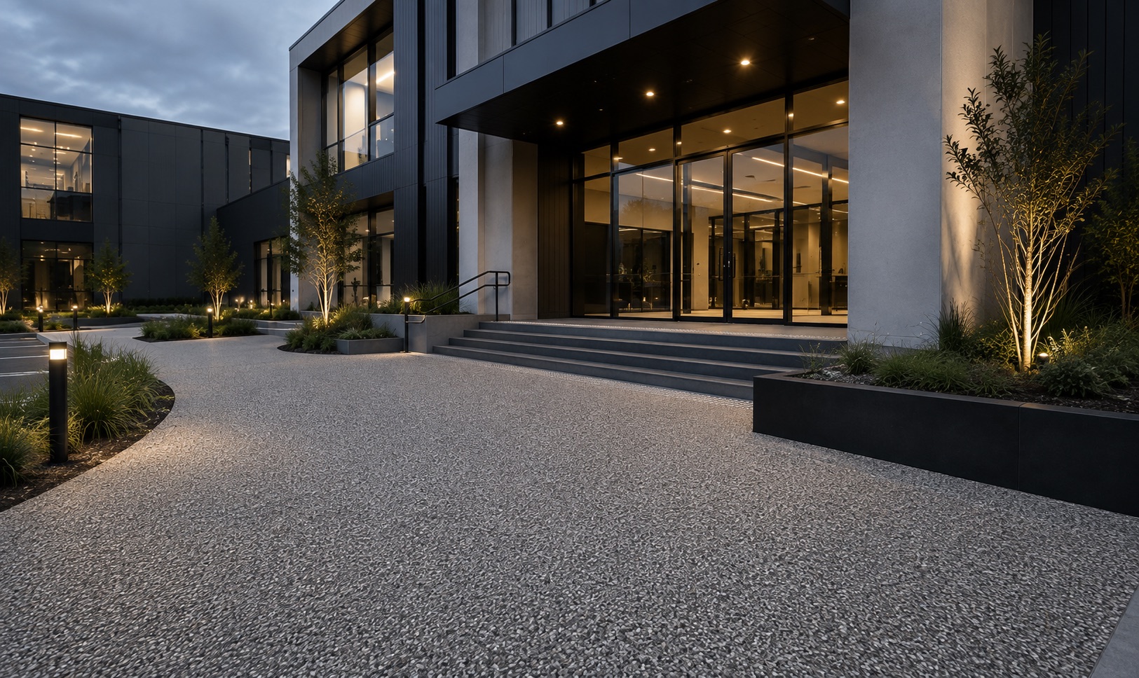 Resin bound entrance driveway at a commercial building forecourt in the evening